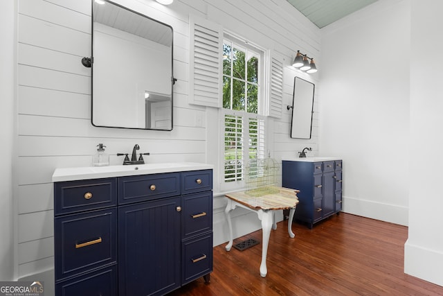 110 College Blvd, Statesboro, GA 30458 - bathroom with wood finished floors, vanity, and wooden walls
