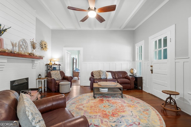 110 College Blvd, Statesboro, GA 30458 - living area with beam ceiling, ceiling fan, wood finished floors, a fireplace, and wainscoting