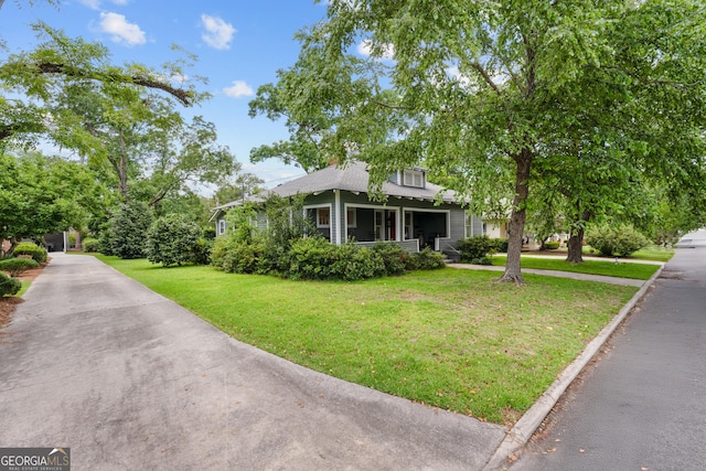 110 College Blvd, Statesboro, GA 30458 - bungalow featuring covered porch, a front lawn, and driveway