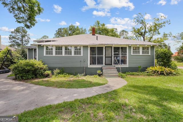 110 College Blvd, Statesboro, GA 30458 - view of front facade with a chimney, a front yard, and entry steps