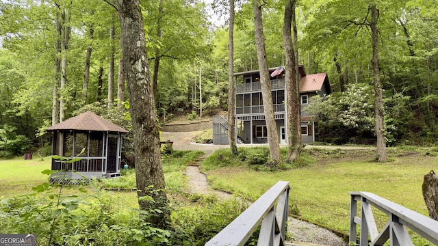 132 Wild Horse Cove Cir, Cleveland, GA 30528 - view of green lawn featuring a gazebo, a balcony, and a view of trees