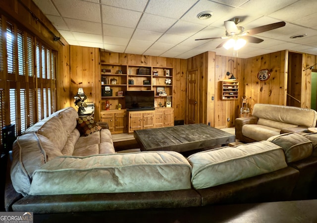132 Wild Horse Cove Cir, Cleveland, GA 30528 - living room featuring wooden walls and a ceiling fan