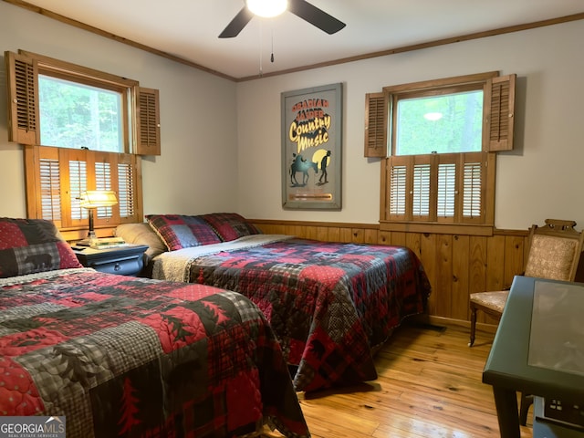 132 Wild Horse Cove Cir, Cleveland, GA 30528 - bedroom with a wainscoted wall, multiple windows, hardwood / wood-style floors, crown molding, and wooden walls