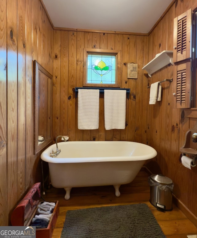 132 Wild Horse Cove Cir, Cleveland, GA 30528 - bathroom featuring wood finished floors, a freestanding bath, and wooden walls