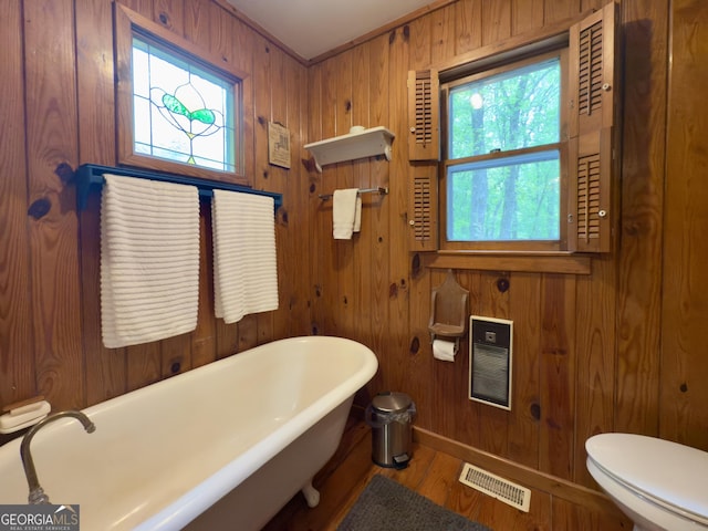 132 Wild Horse Cove Cir, Cleveland, GA 30528 - bathroom featuring a soaking tub, wood finished floors, and wood walls