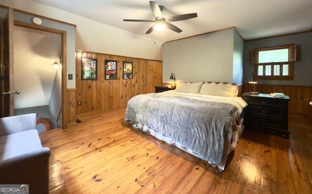 132 Wild Horse Cove Cir, Cleveland, GA 30528 - bedroom with wood walls, wainscoting, wood-type flooring, and ceiling fan