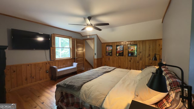 132 Wild Horse Cove Cir, Cleveland, GA 30528 - bedroom featuring wood walls, hardwood / wood-style flooring, a wainscoted wall, and ceiling fan