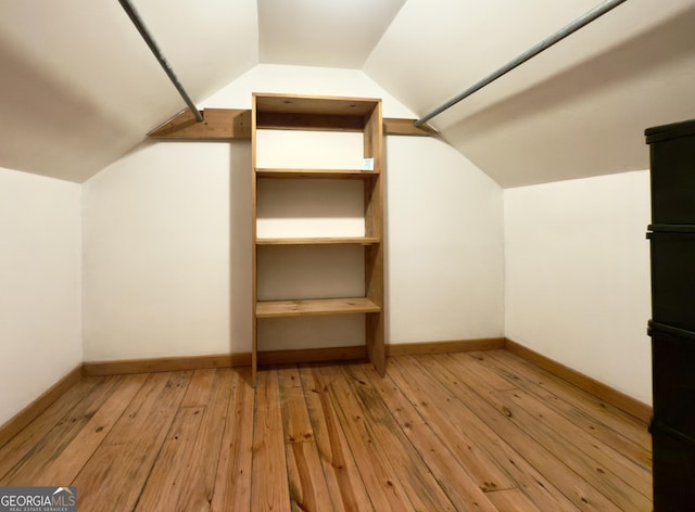 132 Wild Horse Cove Cir, Cleveland, GA 30528 - walk in closet with lofted ceiling and light wood-type flooring