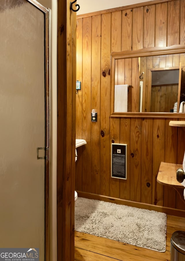 132 Wild Horse Cove Cir, Cleveland, GA 30528 - full bathroom featuring a stall shower, wood finished floors, wooden walls, and heating unit
