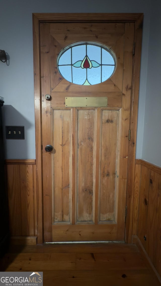 132 Wild Horse Cove Cir, Cleveland, GA 30528 - detailed view of a wainscoted wall, wood finished floors, and wooden walls