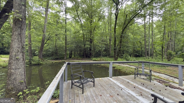 132 Wild Horse Cove Cir, Cleveland, GA 30528 - wooden terrace with a wooded view and a water view