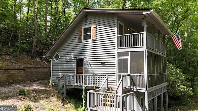 132 Wild Horse Cove Cir, Cleveland, GA 30528 - view of home's exterior with a balcony, stairs, and a sunroom