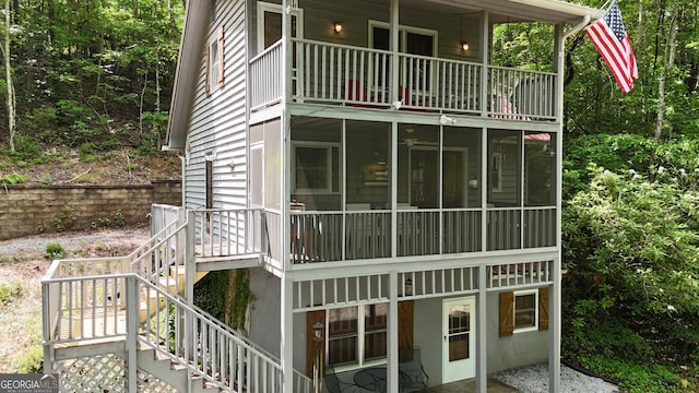 132 Wild Horse Cove Cir, Cleveland, GA 30528 - view of side of property with a balcony, stairway, and a sunroom