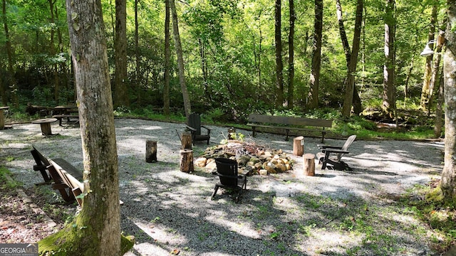 132 Wild Horse Cove Cir, Cleveland, GA 30528 - view of yard with a fire pit and a forest view