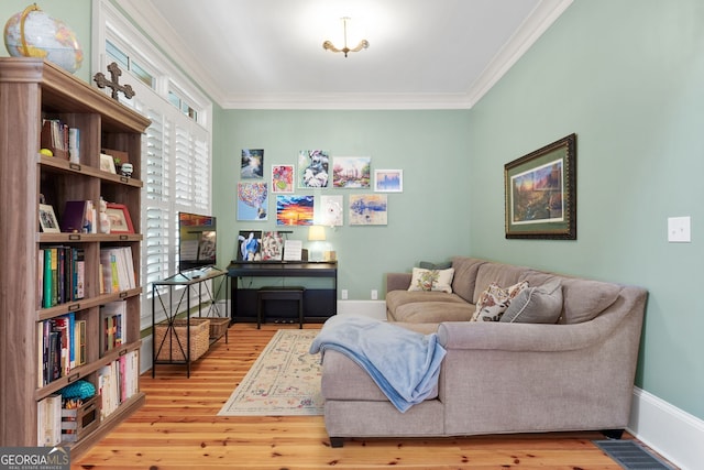 5130 Pratt St SW, Covington, GA 30014 - living area featuring wood finished floors and ornamental molding