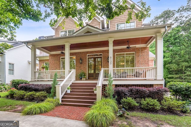 5130 Pratt St SW, Covington, GA 30014 - craftsman inspired home with covered porch, ceiling fan, brick siding, and french doors