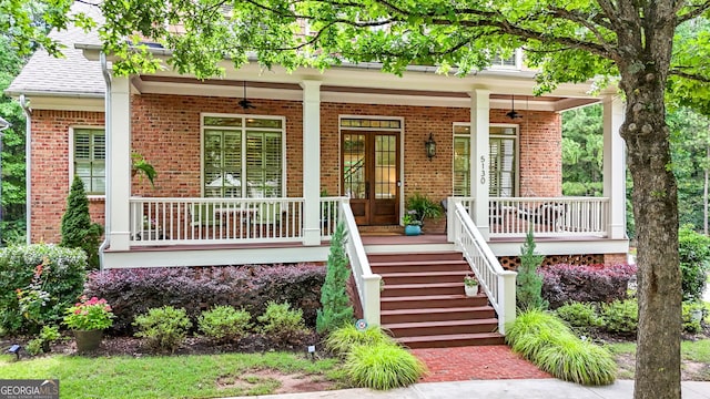 5130 Pratt St SW, Covington, GA 30014 - view of exterior entry with a porch, ceiling fan, and brick siding