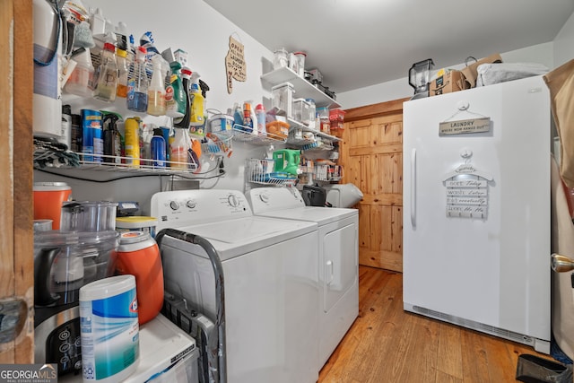 2296 Athens Rd, Royston, GA 30662 - washroom featuring light wood-style flooring and washer and clothes dryer