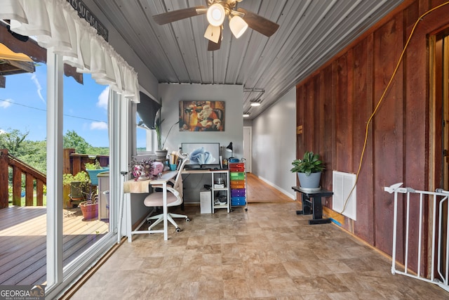 2296 Athens Rd, Royston, GA 30662 - office space featuring a ceiling fan, stone finish flooring, and wooden walls
