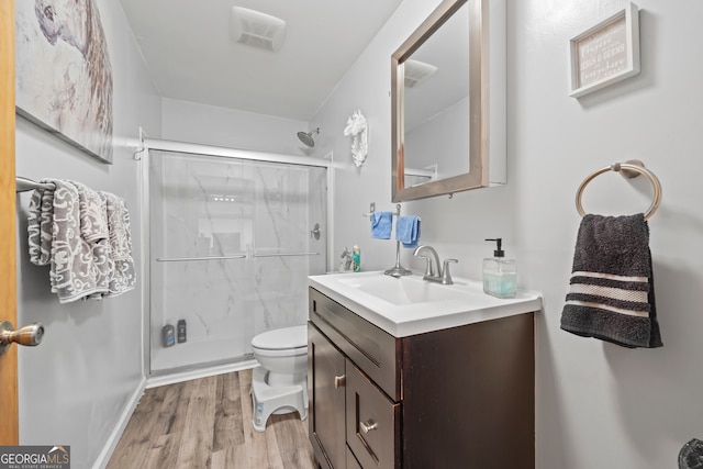 2296 Athens Rd, Royston, GA 30662 - full bathroom with a stall shower, vanity, and wood finished floors