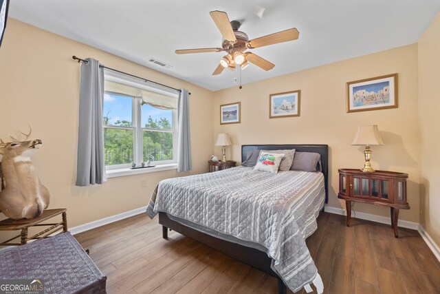 2296 Athens Rd, Royston, GA 30662 - bedroom with wood finished floors and a ceiling fan