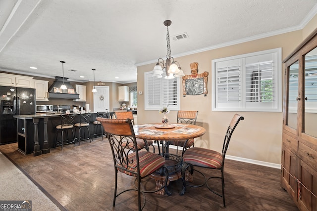 2296 Athens Rd, Royston, GA 30662 - dining room featuring dark wood-style flooring, ornamental molding, a chandelier, recessed lighting, and a textured ceiling