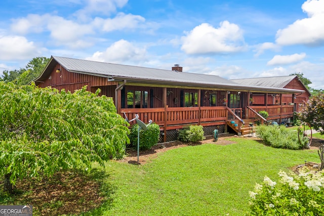 2296 Athens Rd, Royston, GA 30662 - back of house with a lawn, a chimney, and a metal roof