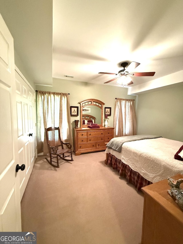 105 Evergreen Rd, Hiawassee, GA 30546 - bedroom with light colored carpet, multiple windows, ceiling fan, and a closet