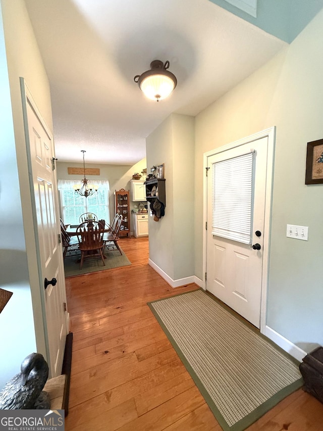 105 Evergreen Rd, Hiawassee, GA 30546 - foyer featuring light wood-type flooring and a chandelier