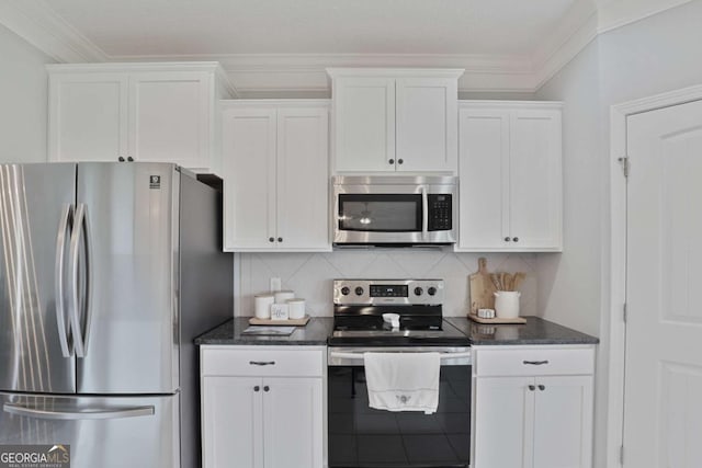 358 Brookhaven Loop NE, Ludowici, GA 31316 - kitchen with appliances with stainless steel finishes, white cabinets, dark stone countertops, and crown molding