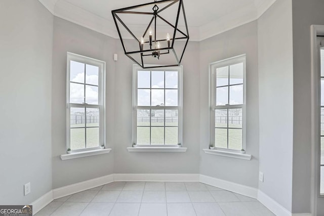 358 Brookhaven Loop NE, Ludowici, GA 31316 - unfurnished dining area with a chandelier, ornamental molding, and light tile patterned floors