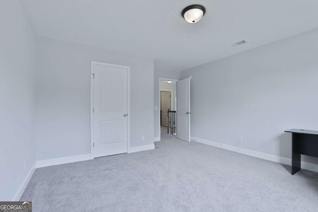 358 Brookhaven Loop NE, Ludowici, GA 31316 - unfurnished bedroom with carpet floors