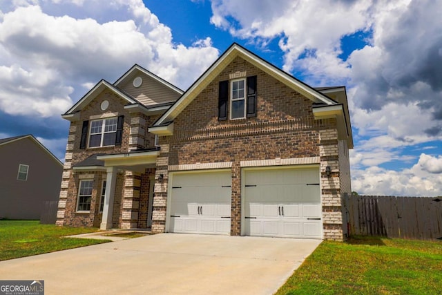 358 Brookhaven Loop NE, Ludowici, GA 31316 - view of front of home featuring brick siding, concrete driveway, and a garage