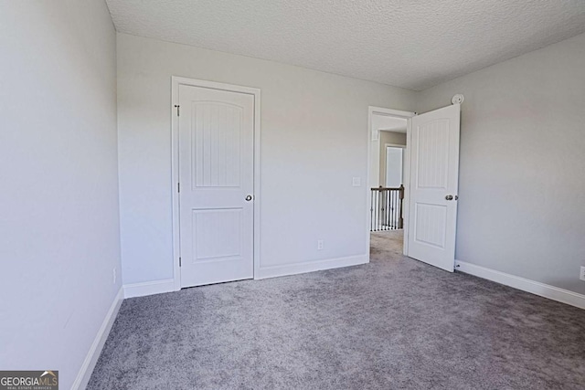 358 Brookhaven Loop NE, Ludowici, GA 31316 - unfurnished bedroom with carpet floors and a textured ceiling