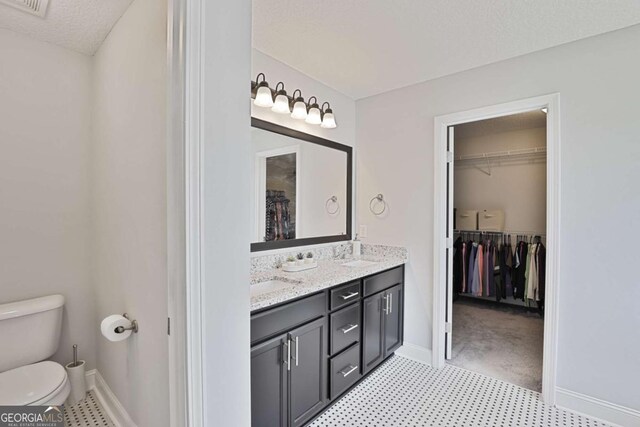 358 Brookhaven Loop NE, Ludowici, GA 31316 - bathroom featuring a walk in closet and double vanity