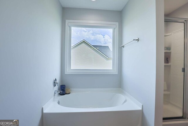 358 Brookhaven Loop NE, Ludowici, GA 31316 - full bath featuring a shower stall and a garden tub