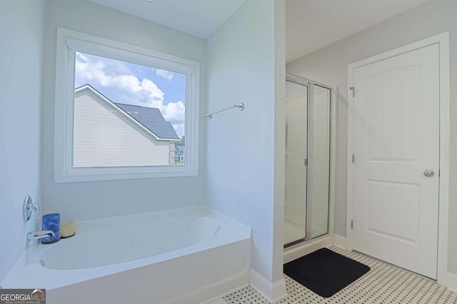 358 Brookhaven Loop NE, Ludowici, GA 31316 - full bathroom featuring a stall shower, a bath, and tile patterned floors