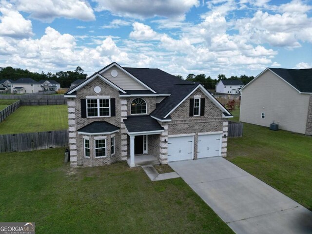 358 Brookhaven Loop NE, Ludowici, GA 31316 - traditional-style home with concrete driveway, brick siding, and a garage