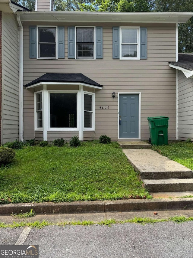 4807 Hairston Pl, Stone Mountain, GA 30088 - view of front of home featuring a front yard and a chimney