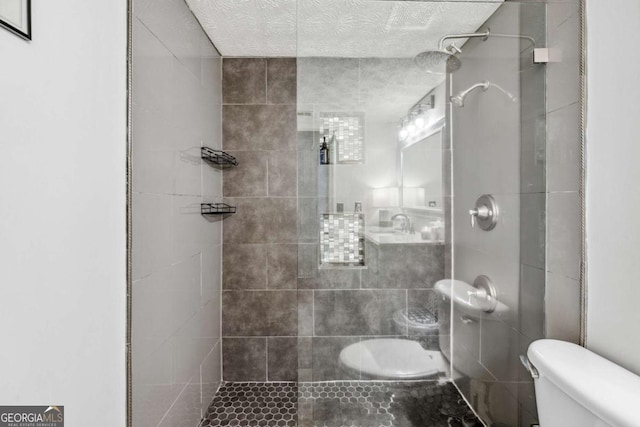 3115 Seven Pines Ct Unit 308, Atlanta, GA 30339 - bathroom with tiled shower and a textured ceiling