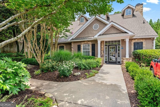 3115 Seven Pines Ct Unit 308, Atlanta, GA 30339 - view of front of home with roof with shingles, a chimney, and stone siding