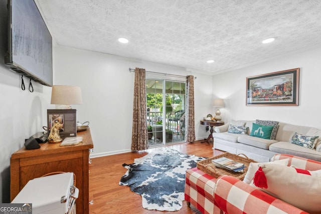 3115 Seven Pines Ct Unit 308, Atlanta, GA 30339 - living area with light wood finished floors, a textured ceiling, and recessed lighting