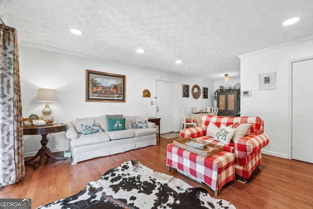 3115 Seven Pines Ct Unit 308, Atlanta, GA 30339 - living area with crown molding, a textured ceiling, wood finished floors, and recessed lighting