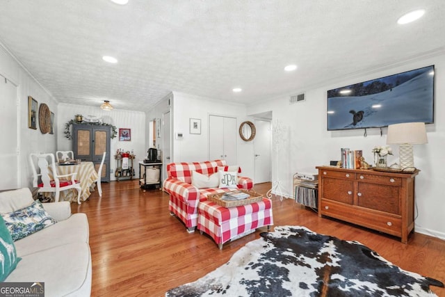 3115 Seven Pines Ct Unit 308, Atlanta, GA 30339 - living room with wood finished floors, crown molding, and recessed lighting