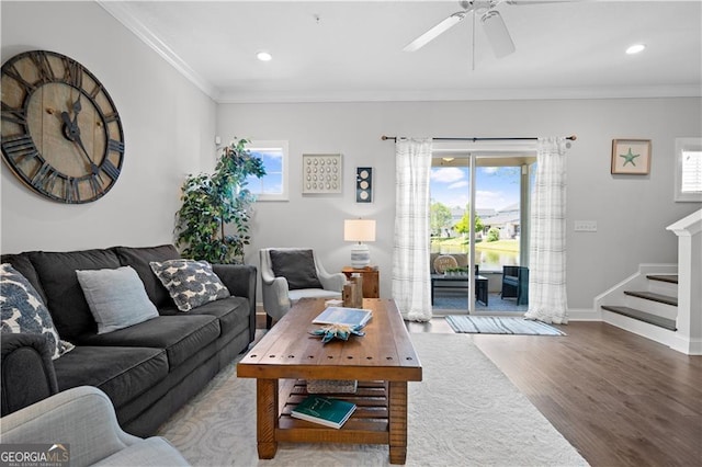 509 Mariners Cir, Saint Simons, GA 31522 - living room with wood finished floors, plenty of natural light, crown molding, stairs, and a ceiling fan