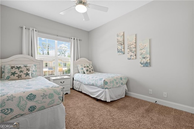 509 Mariners Cir, Saint Simons, GA 31522 - carpeted bedroom featuring baseboards and a ceiling fan