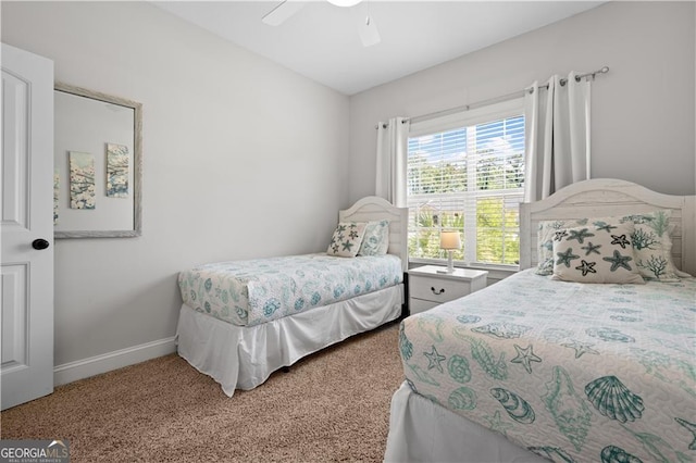 509 Mariners Cir, Saint Simons, GA 31522 - carpeted bedroom with baseboards and ceiling fan