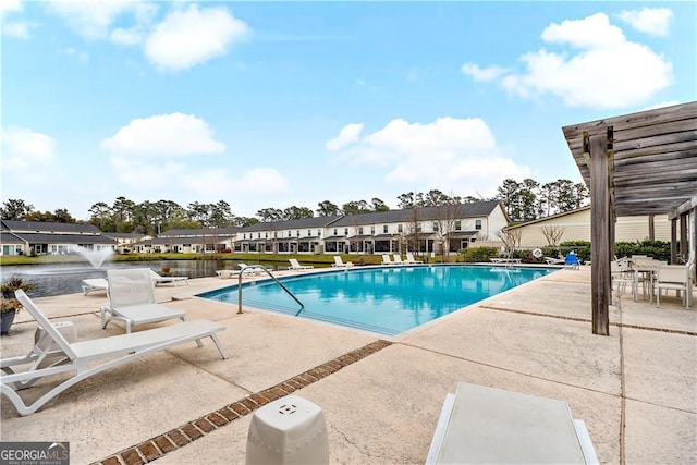 509 Mariners Cir, Saint Simons, GA 31522 - community pool featuring a patio and a residential view
