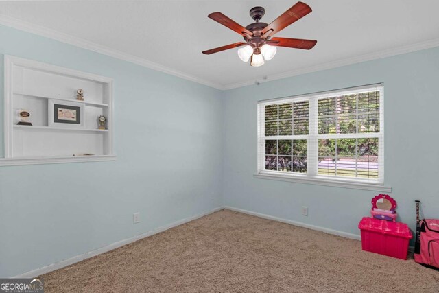1207 College Ave, Blackshear, GA 31516 - rec room with carpet flooring, ceiling fan, ornamental molding, and built in shelves