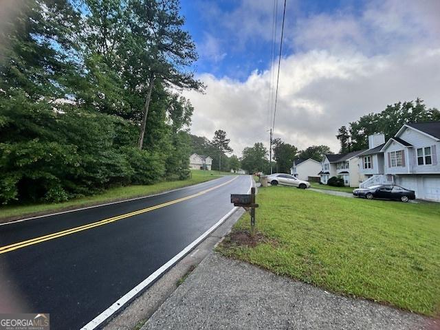 8519 Glenwoods Dr, Riverdale, GA 30274 - view of asphalt street with a residential view